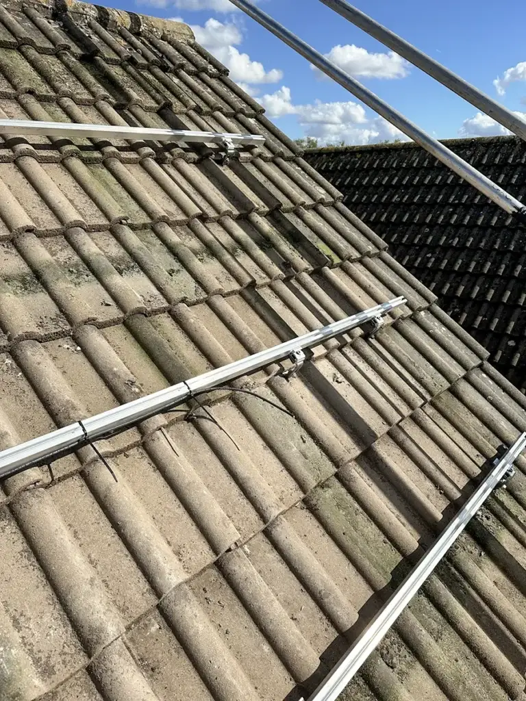 Solar panel mounting rails fixed to a tiled roof